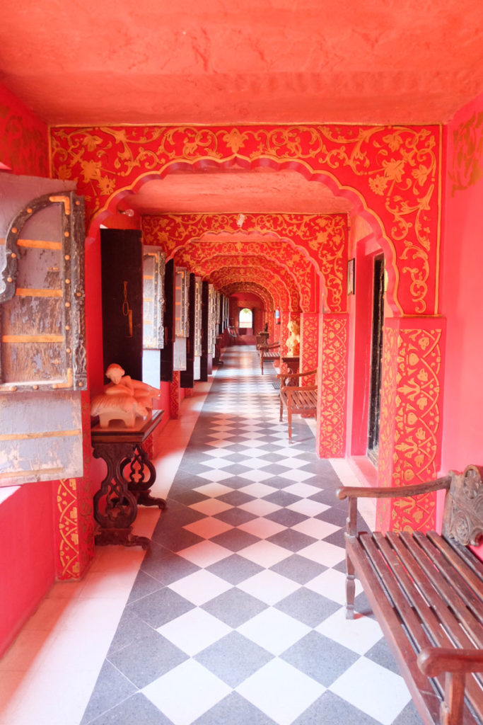 Red and gold ornately painted corridor India - career travel break