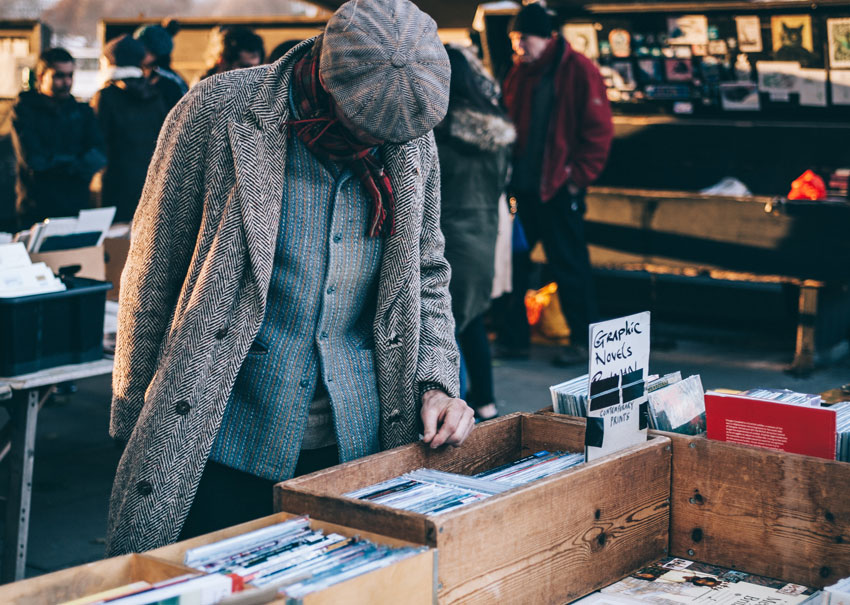 Man browsing records at a market