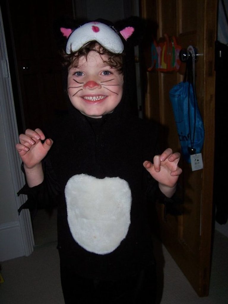Small boy in preloved Halloween cat costume