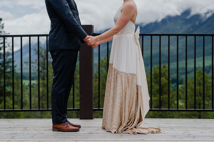 Bride and groom standing facing each other