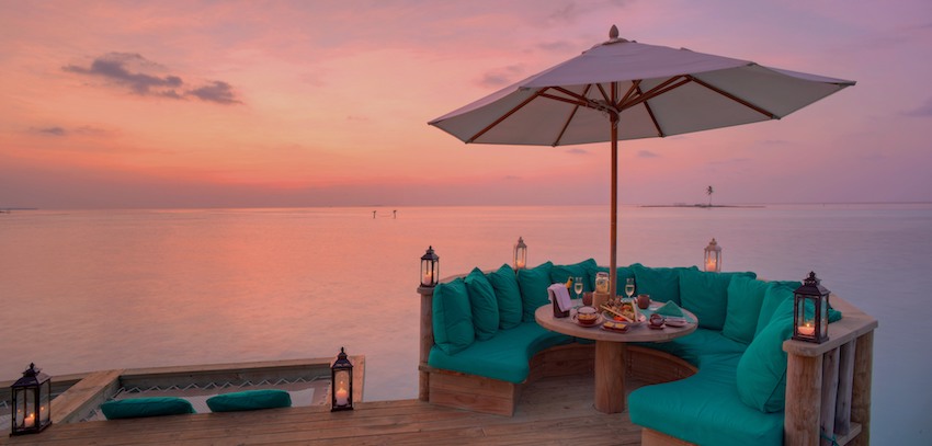 Over water bar at sunset, the Maldives