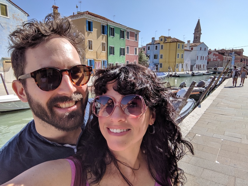 Couple taking selfie on honeymoon in Italy