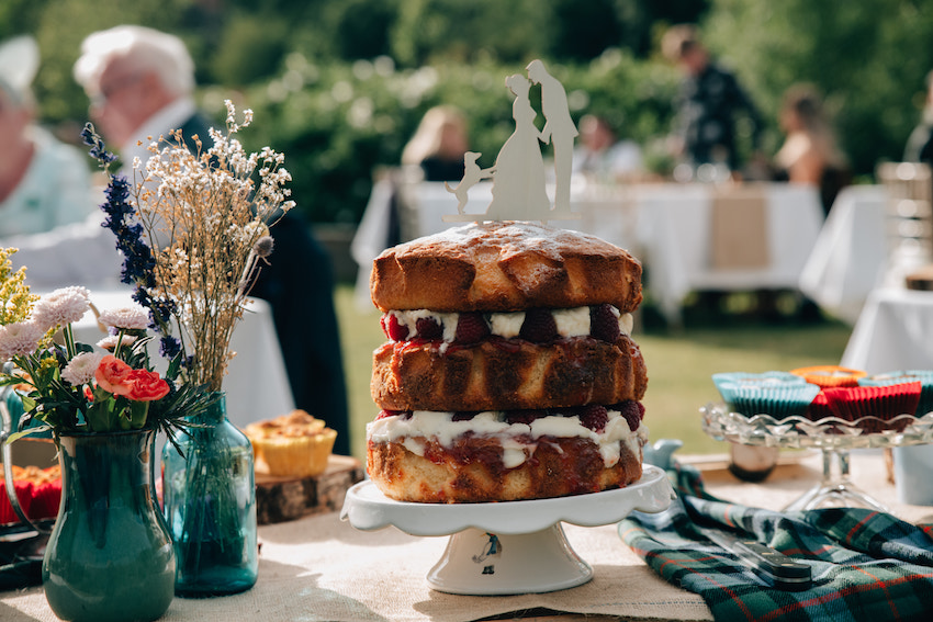 home made wedding cake on table in sunshine
